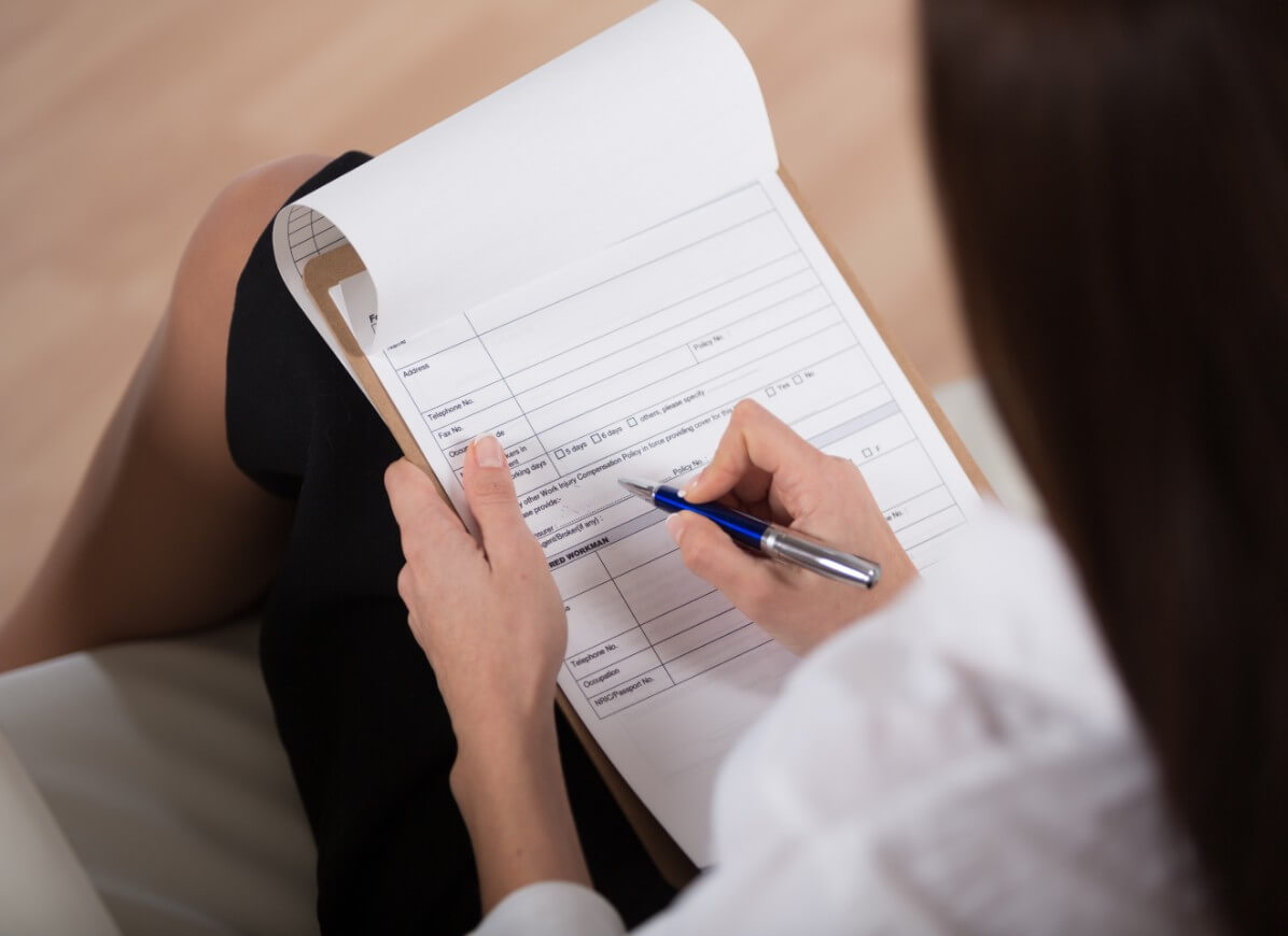 Patient filling out a new patient form
